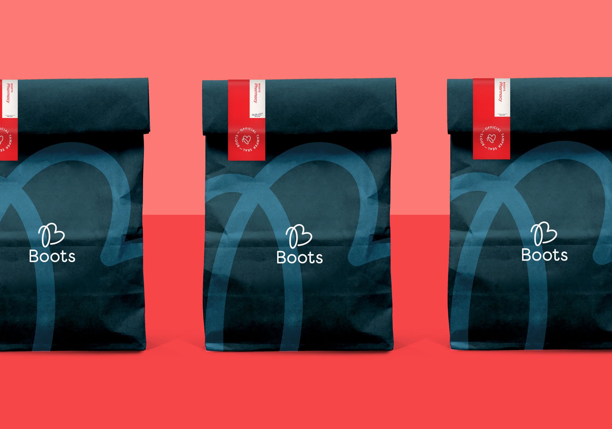 Blue Boots Pharmacy bags with the logo printed on the front, and a "safety seal" sticker to close the bag.