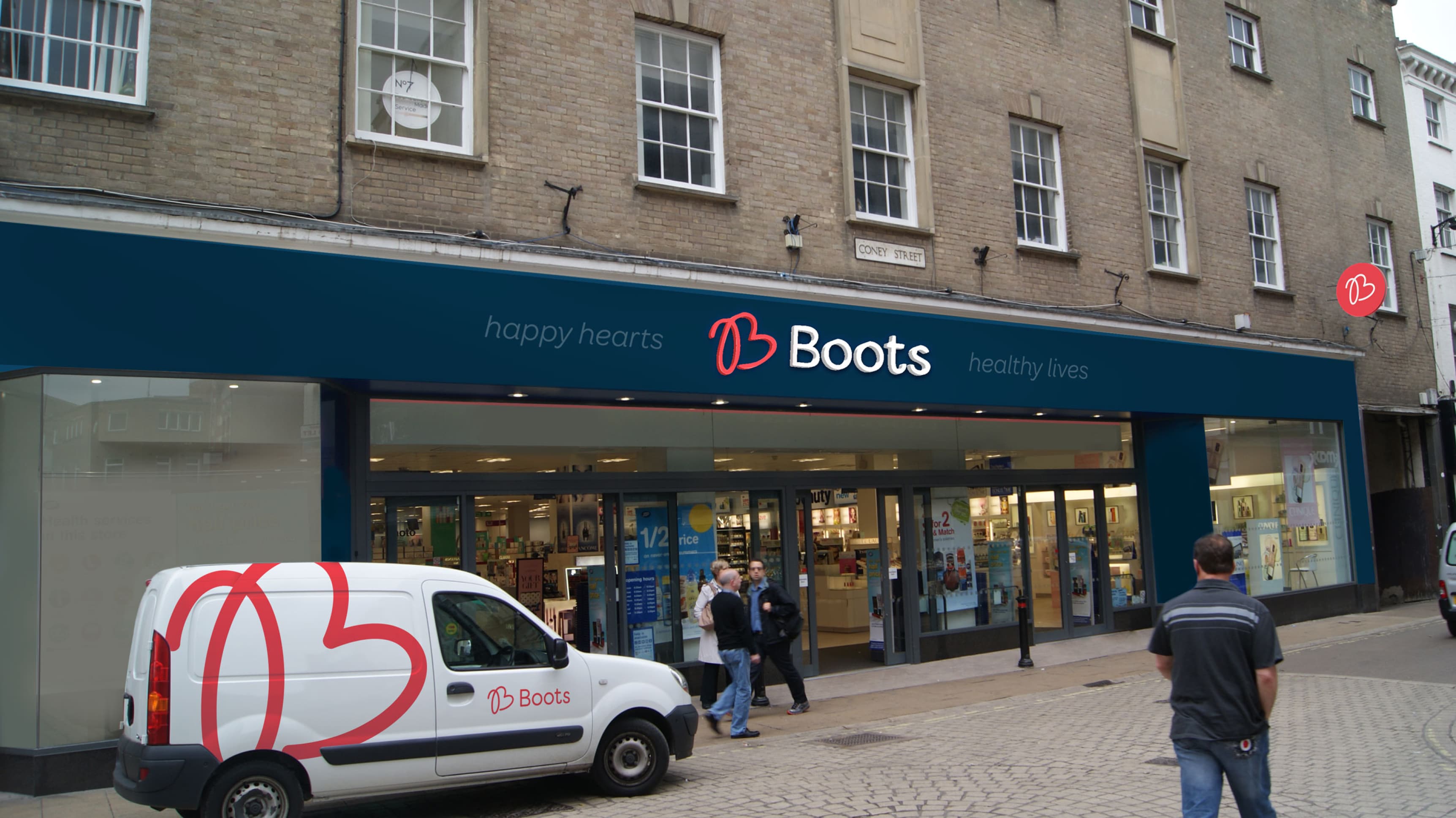 Boots storefront after the rebrand, showing the new logo above the door, new colors for the walls and additional signage featuring the logo outside the store.