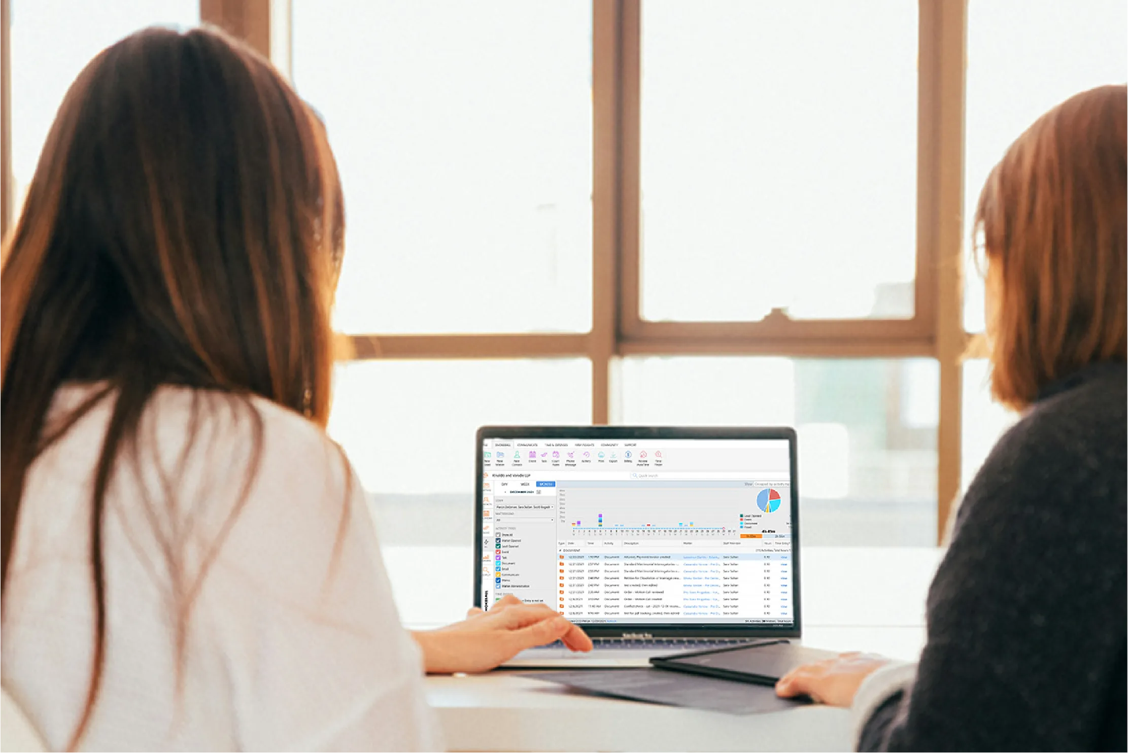 Women look at a computer with Smokeball on the screen