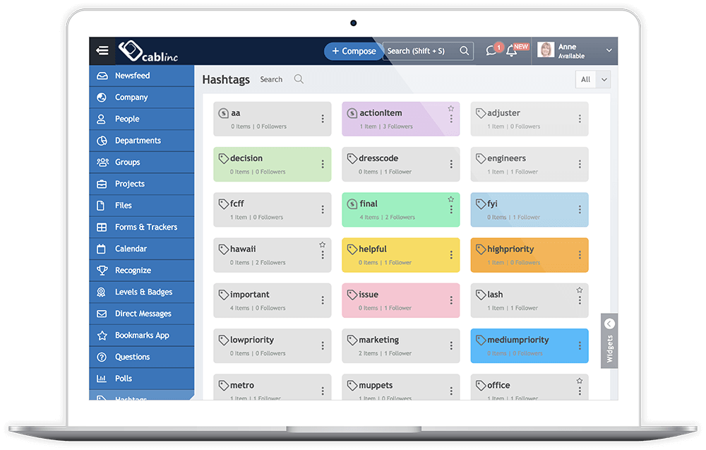 Laptop screen showing CabInc interface with a sidebar menu and a grid of various colored hashtag tags and follower counts.