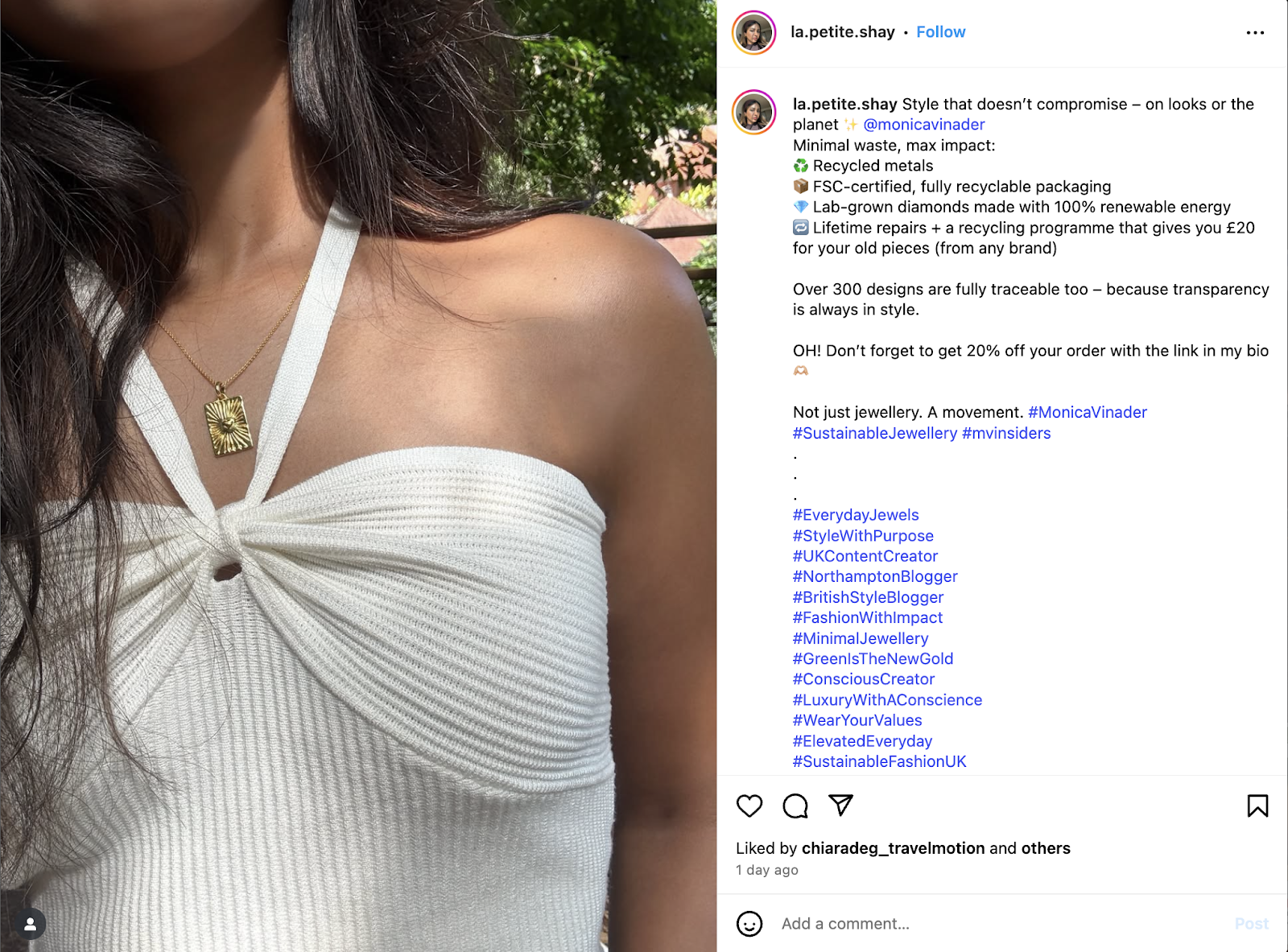 A close-up of a woman wearing a white ribbed halter top and a gold pendant necklace. 