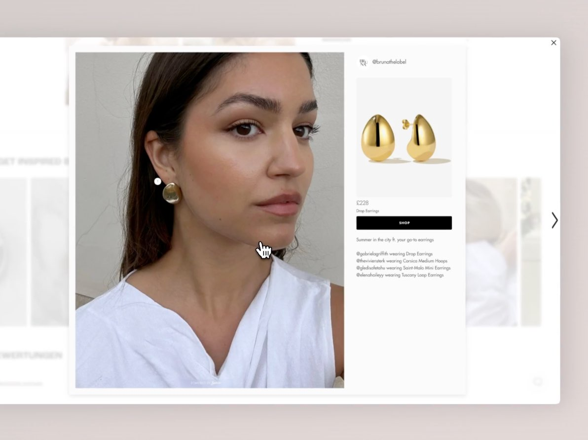 Close-up of a woman wearing large gold drop earrings, with a shoppable overlay showing product name, price, and a “Shop” button for direct purchase.