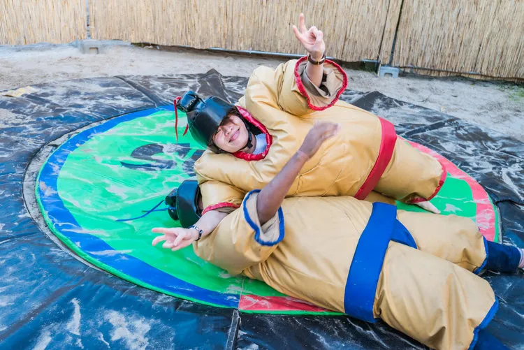 Alvin, Regional Manager Greater China &amp; Japan, tackling Abhi, Regional Manager APAC, at our Summer Party