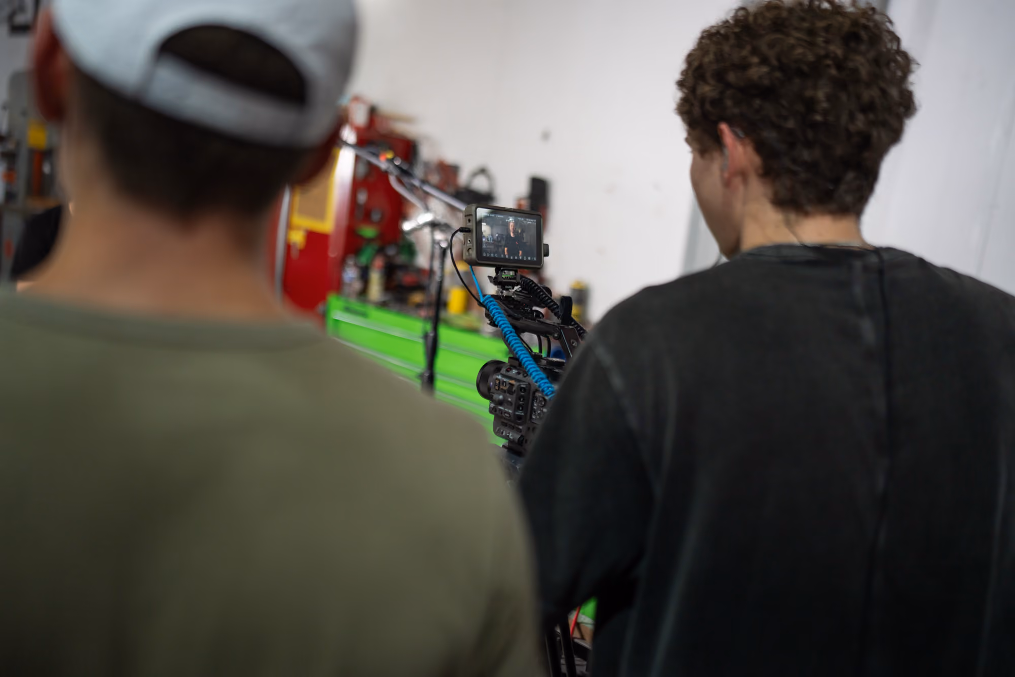 A videographer operating a camera.