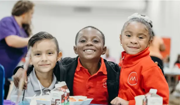 a group of children smiling