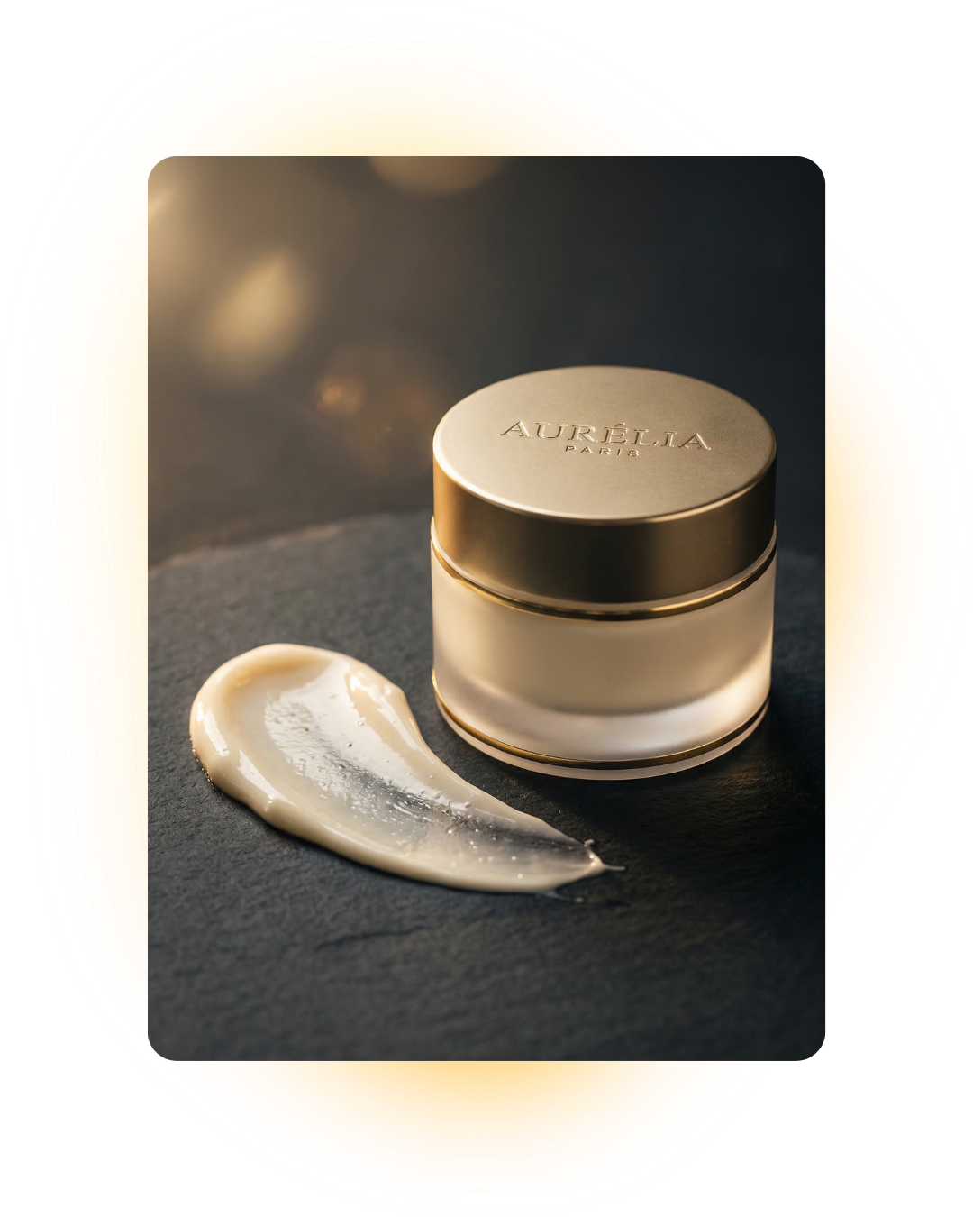A jar of Aurélia Paris cream with a dollop of cream on a dark surface.