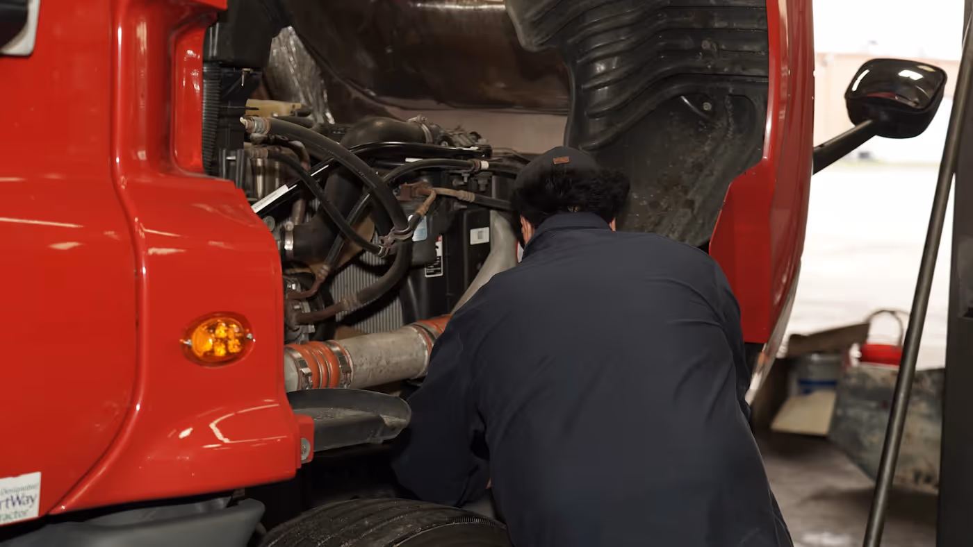 Mechanic performing axle repair in Ft Worth, TX