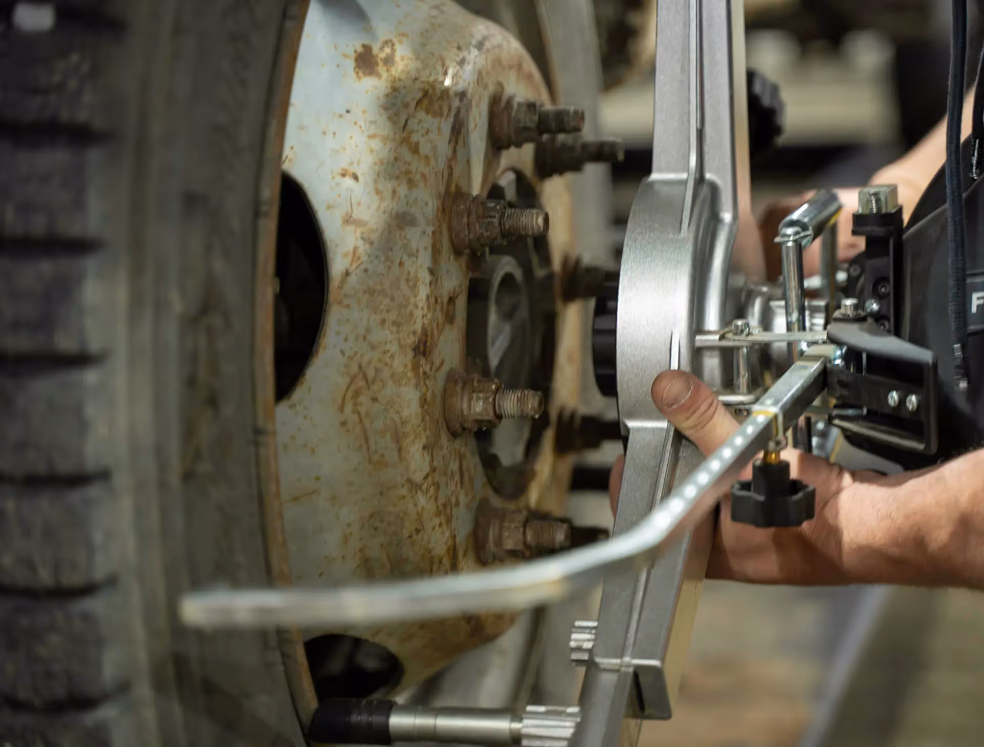 Mechanic performing truck and trailer alignment service from SOS Truck & Trailer Repair