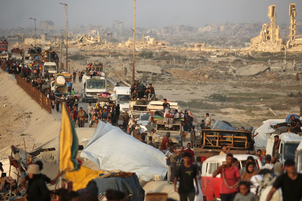 Displaced Palestinians moving south with their belongings in the Nuseirat refugee camp area in the central Gaza Strip.