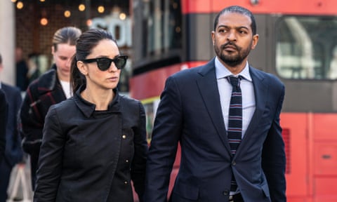 Noel and Iris Clarke in front of a London bus on their way into court