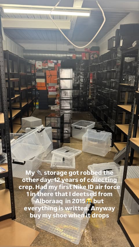 A storage unit with empty shelves and clear plastic boxes scattered on the floor, accompanied by text detailing a robbery.