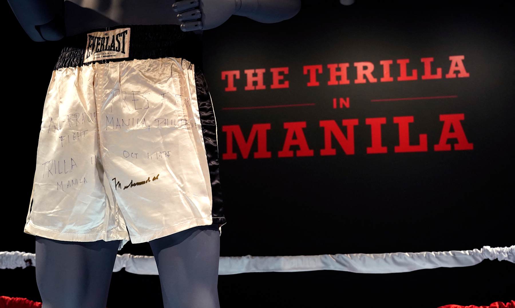 Muhammad Ali's trunks worn during the 1975 legendary match against Joe Frazier, 'The Thrilla in Manila' are on display during 'Sports Week' auctions at Sotheby's in New York City on April 4, 2024. The shorts worn by Muhammad Ali in his legendary "Thrilla in Manila" boxing match are up for grabs at Sotheby's in New York, part of a growing sports memorabilia market eyed by auction houses.Bids -- including the latest for $3.8 million -- have been rolling in since late March for the Everlast-brand shorts, which are white with black stripes and are signed by Ali. (Photo by TIMOTHY A. CLARY / AFP) (Photo by TIMOTHY A. CLARY/AFP via Getty Images)