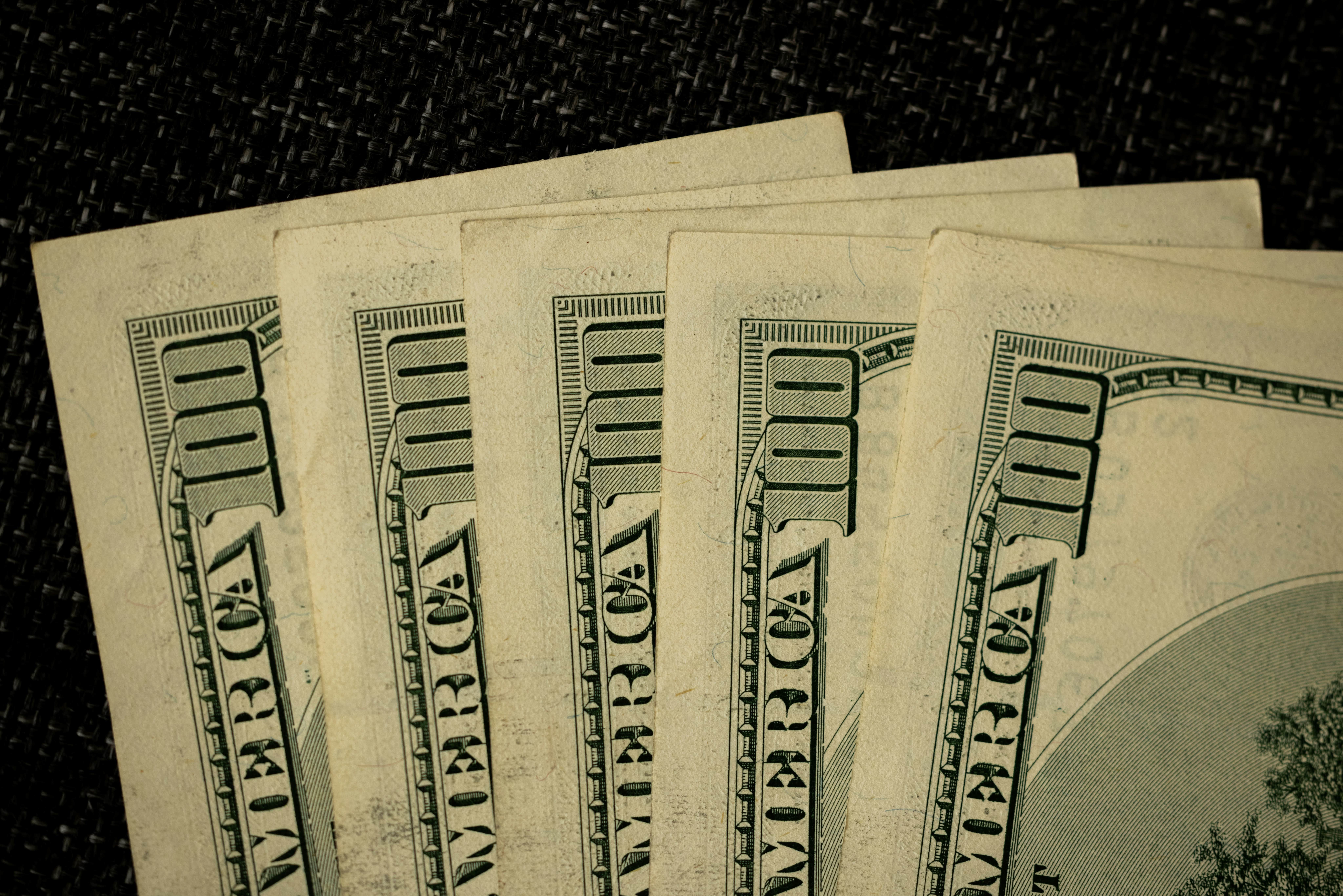$100 bills fanned out. Photo by engin akyurt on Unsplash