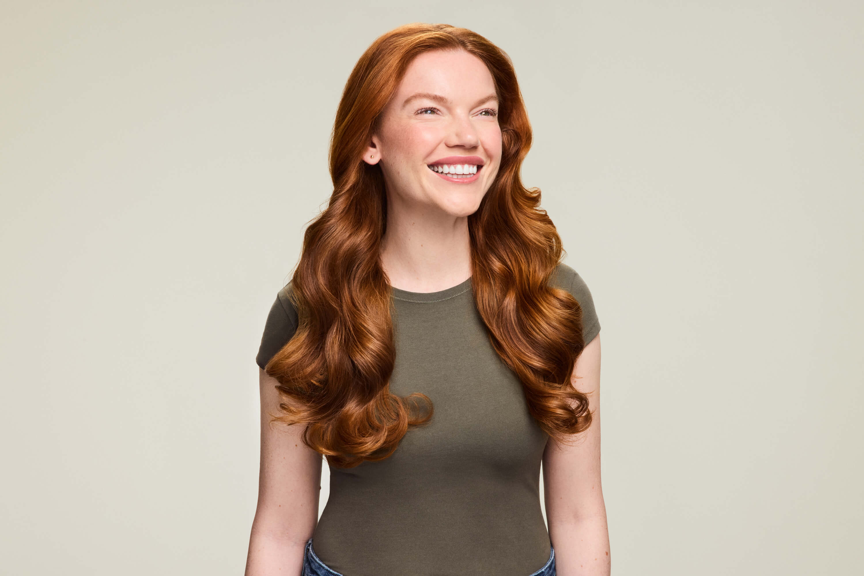 Model with smooth, voluminous hair shot by Brooke Nipar for Shark Beauty, retouching by GentleRetouch.