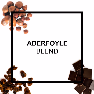 Ed Denyer, founder of Eco Coffee, with a stack of branded cloth coffee bags behind him