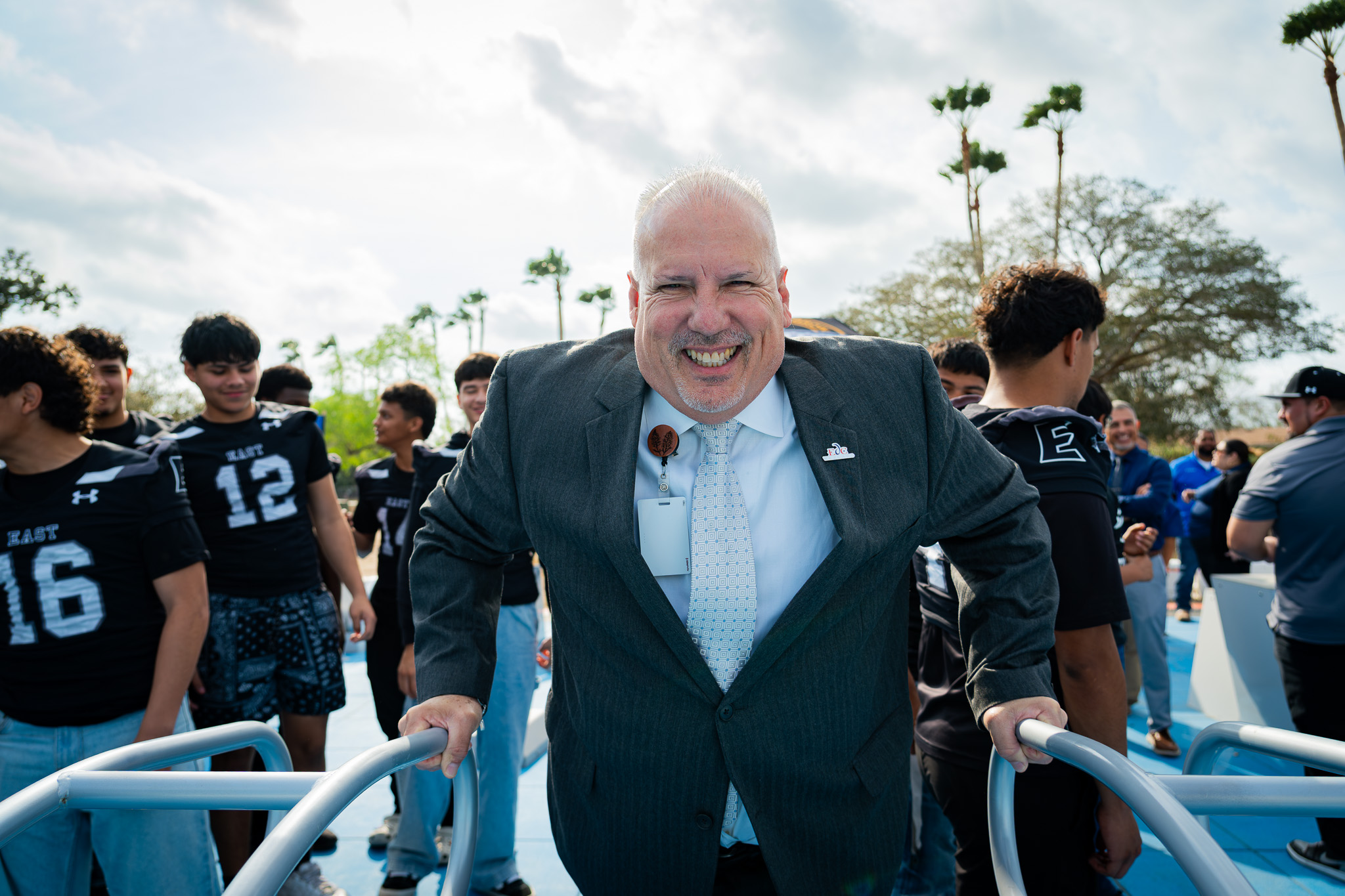 City leader and a high school football team gathered at a Fitness Court installation