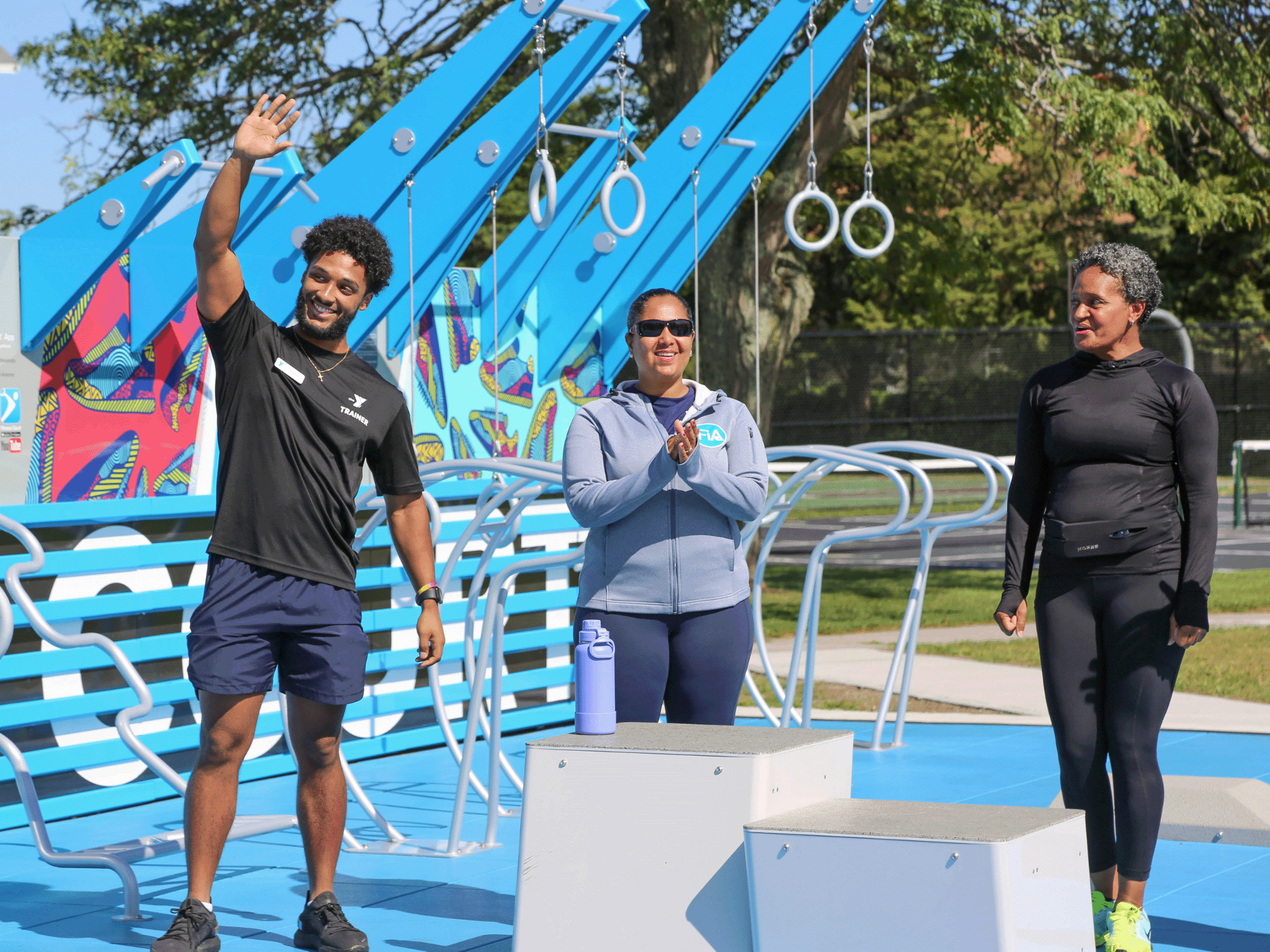 Fitness Court instructor leading a community programming session outdoors