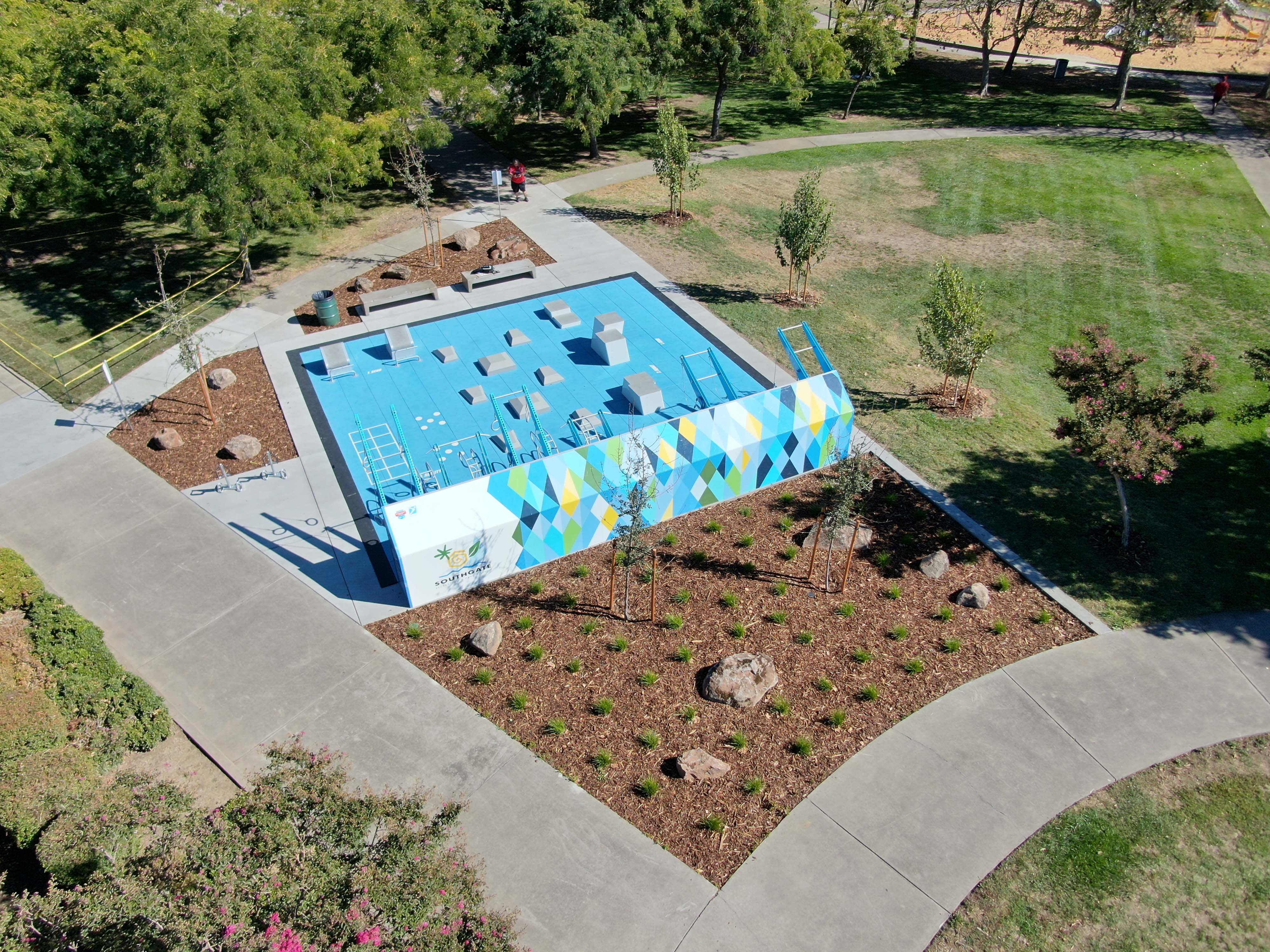 Aerial view of a Fitness Court installation with custom mural art