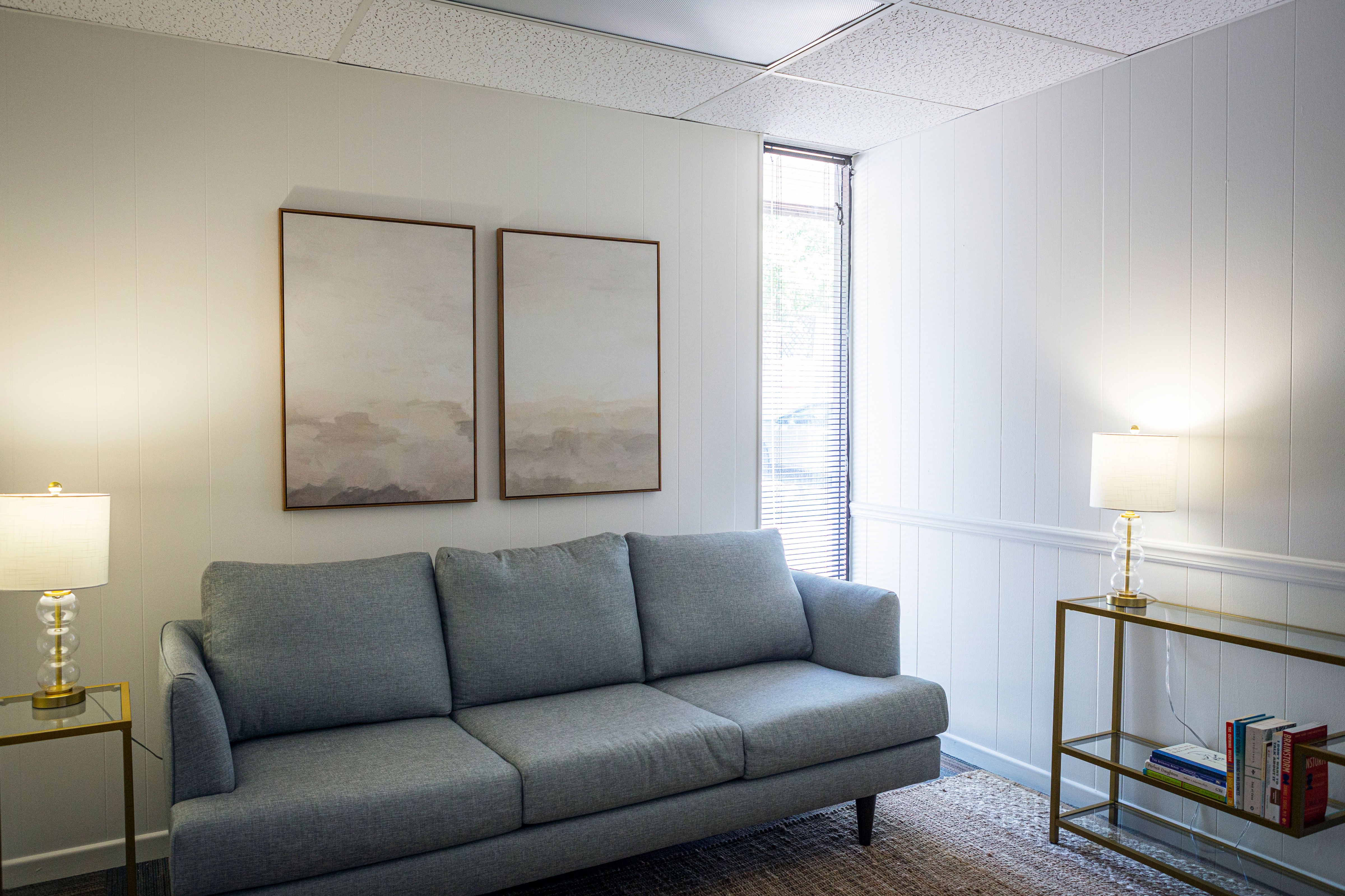 A couch for clients to sit on during session for in-person therapy in Austin, Texas with Decades Counseling.