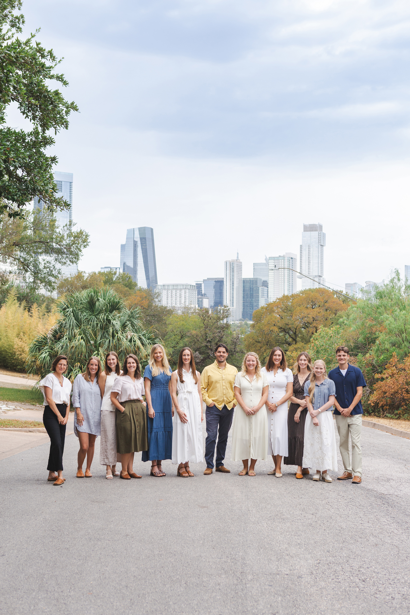 Decades Counseling therapy team standing outdoors with the Austin skyline behind them