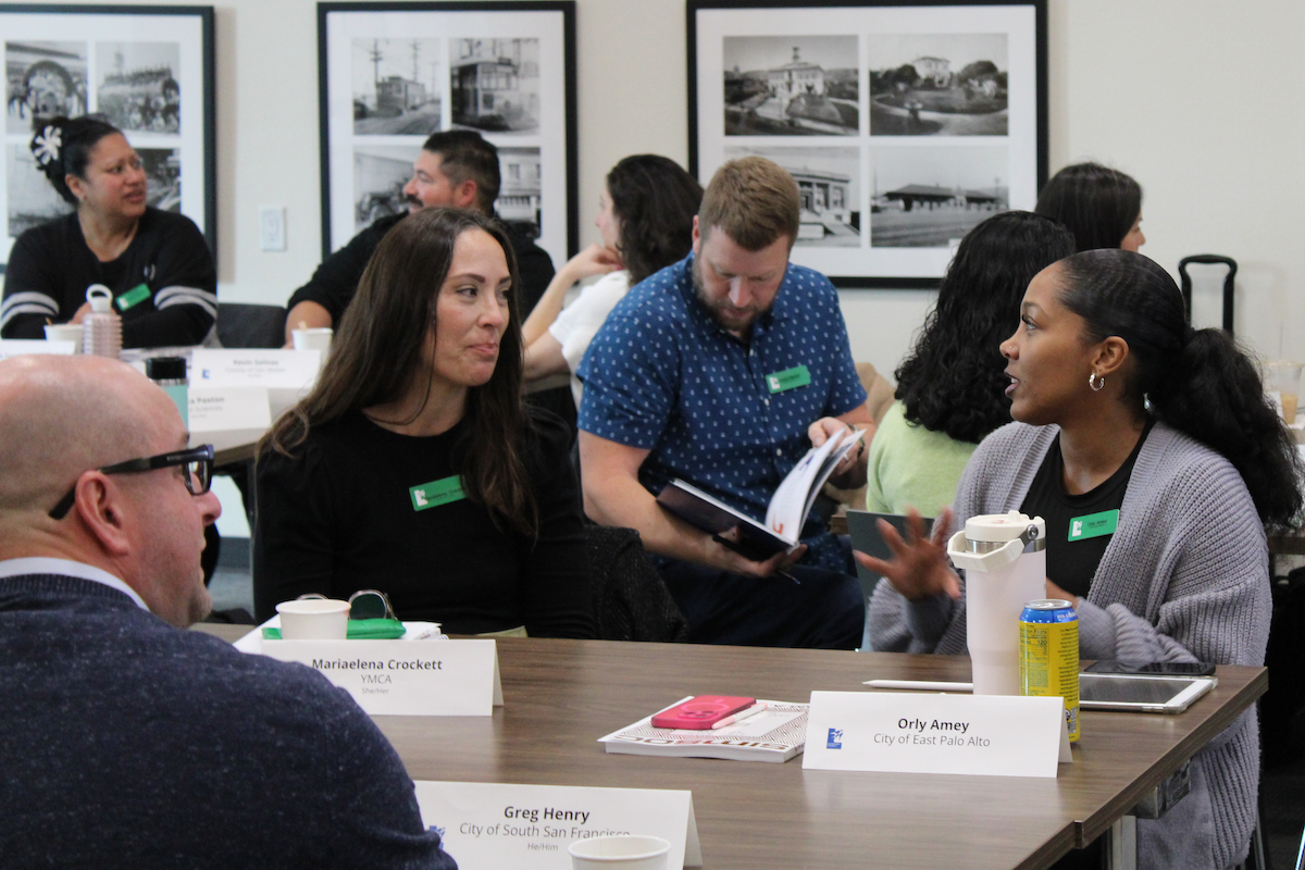 Greg Henry, Mariaelena Crockett, and Orly Amey in discussion at Economic Development Day.
