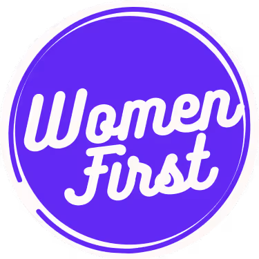 "Women First" text in white script inside a purple circle with white and purple circular border.