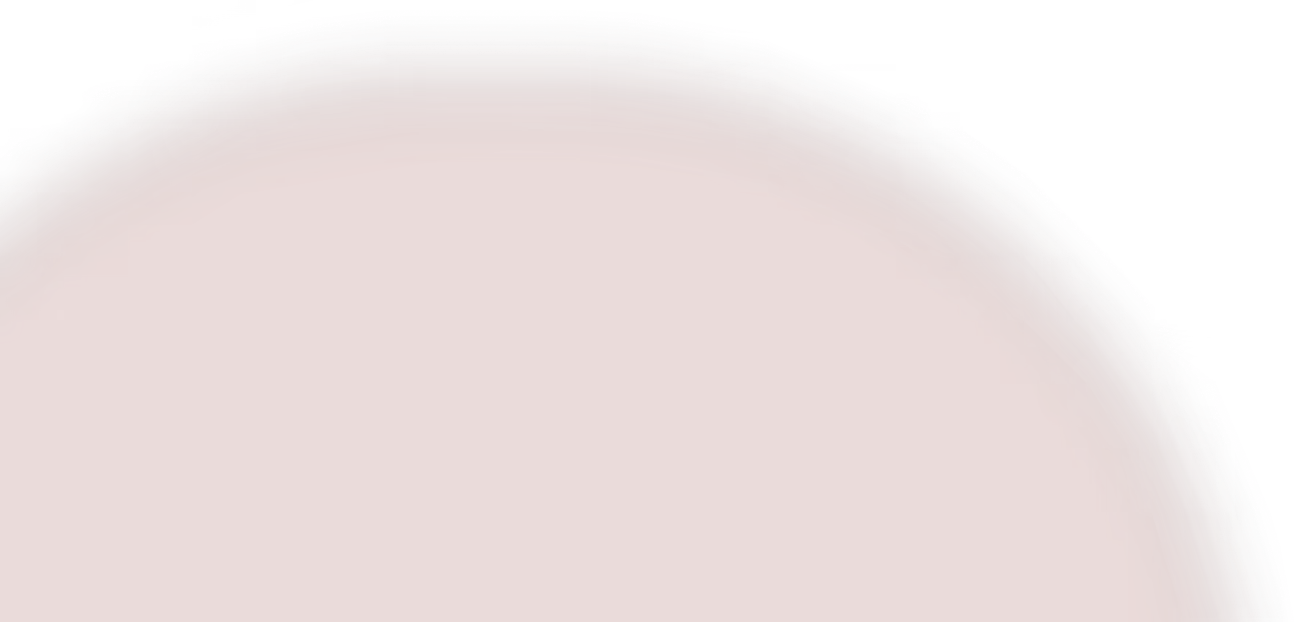 Close-up of a round leaf with a deep reddish-brown surface and smooth texture.