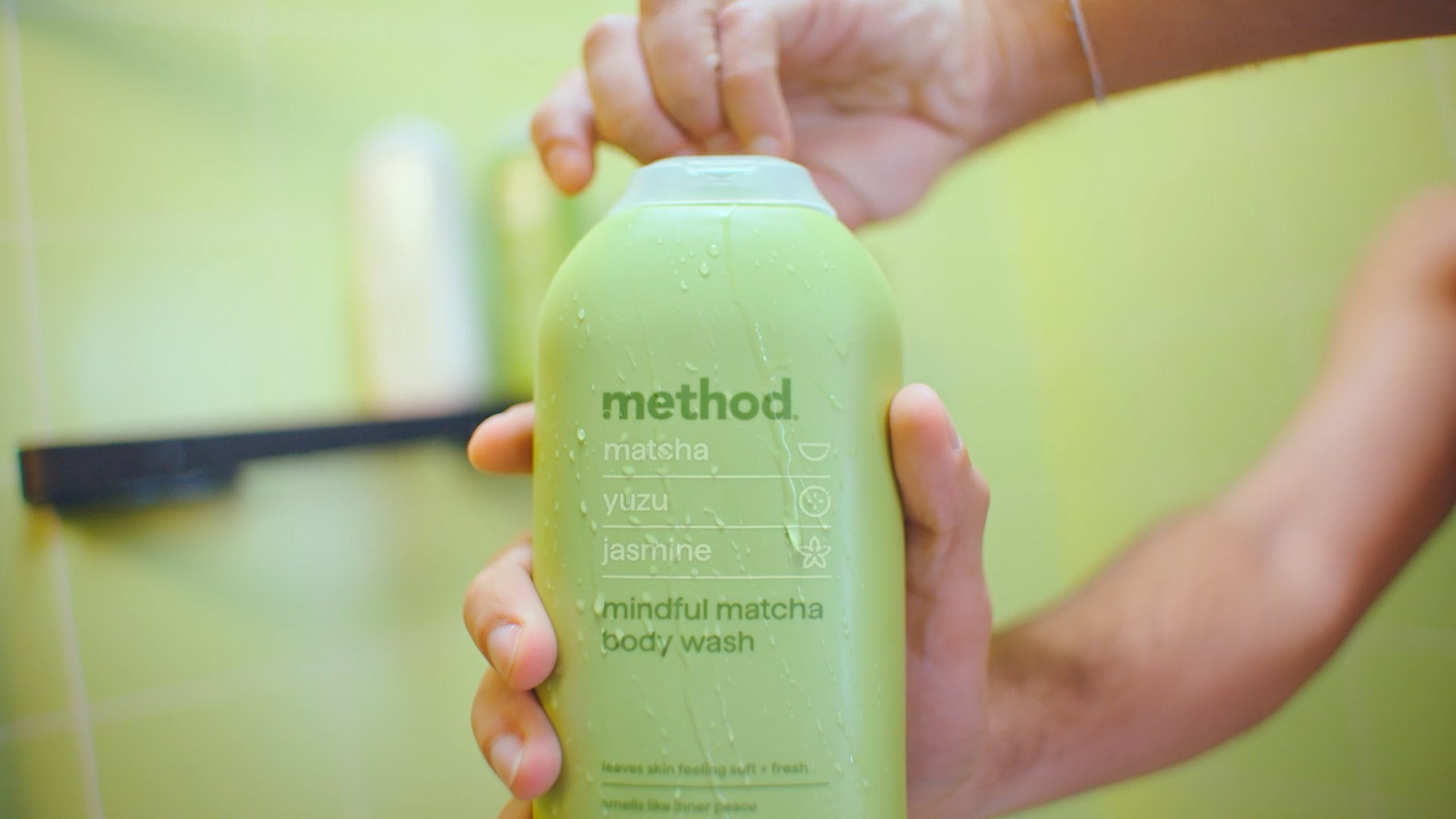 Hand holding a mindful matcha Method body wash