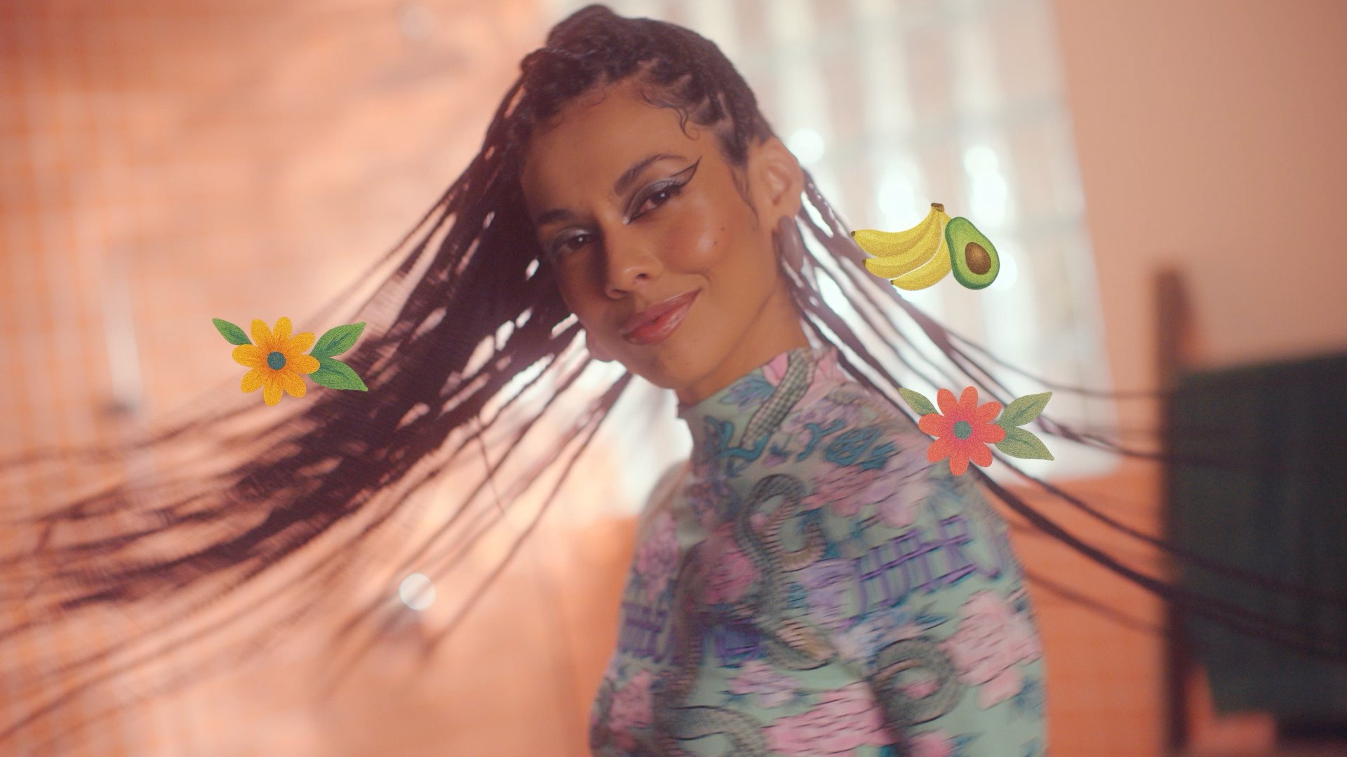 A woman swinging her braids
