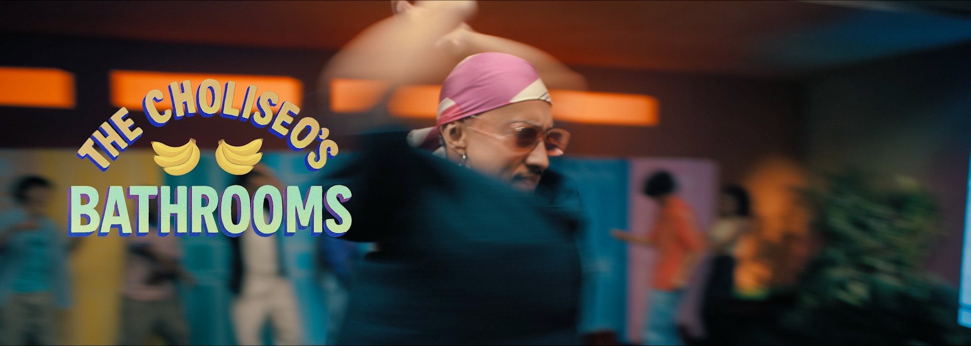 The Choliseo's bathrooms, a man dances past the lockers