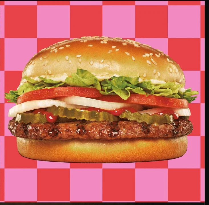 A Whopper on a pink checkered background