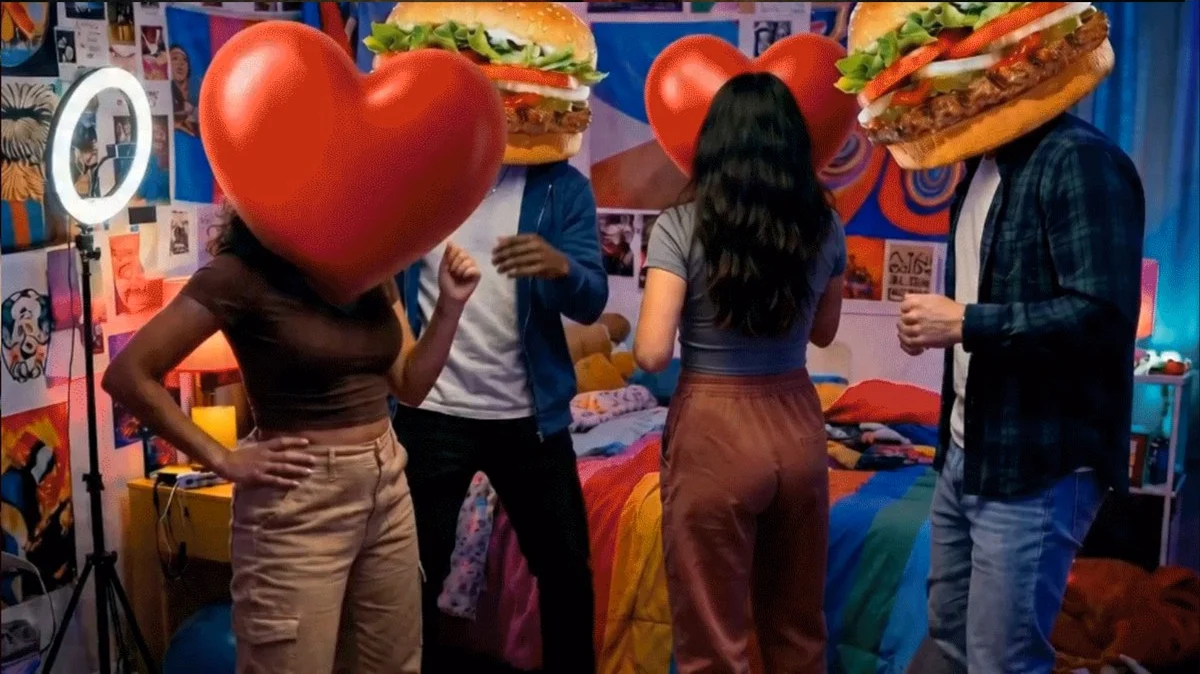 People dancing with heart and burger heads