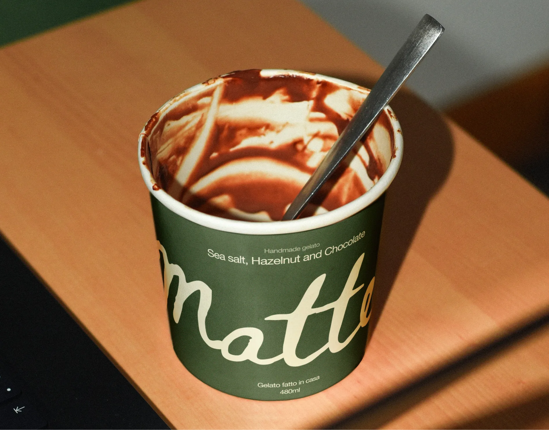 An empty carton of eaten ice cream with the logo for "Matteo" on the packaging.