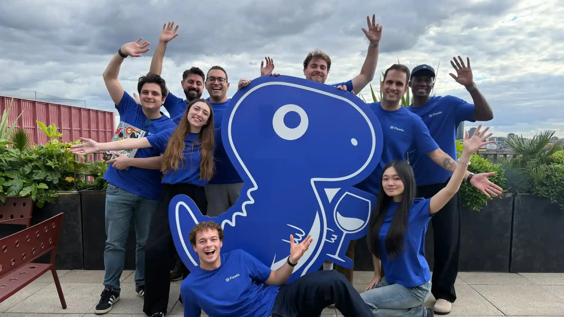 Photo of Flowla team with a life-sized REX