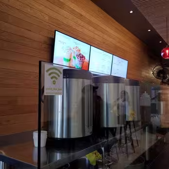Digital signage displaying menus for a tea store