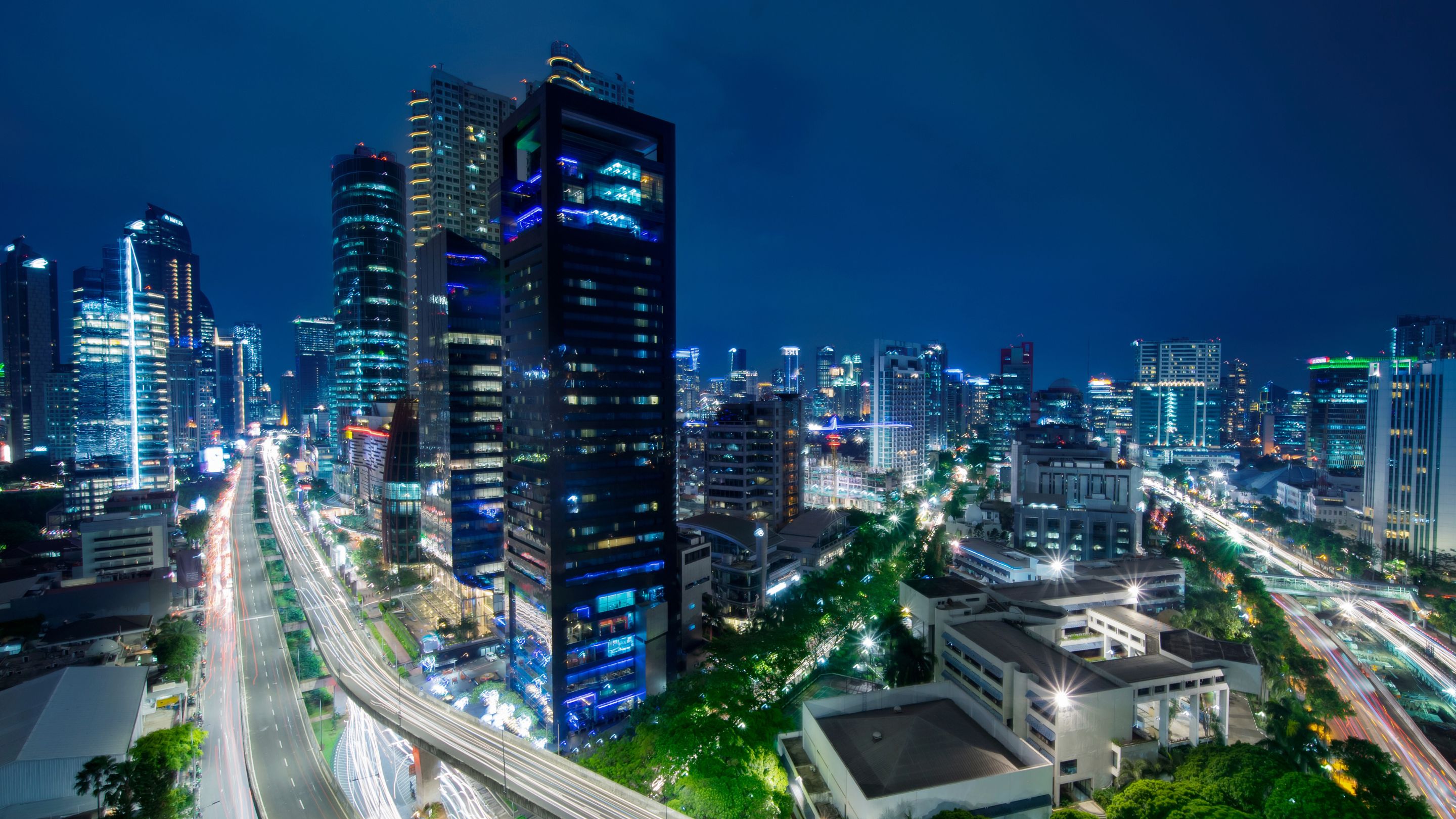 A city at night with a lot of traffic.