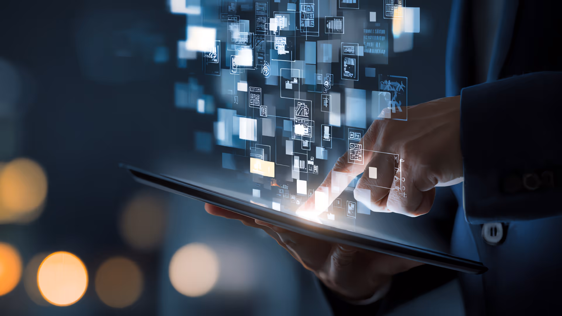 Close-up of a person using a tablet with digital icons and data visuals floating above the screen.