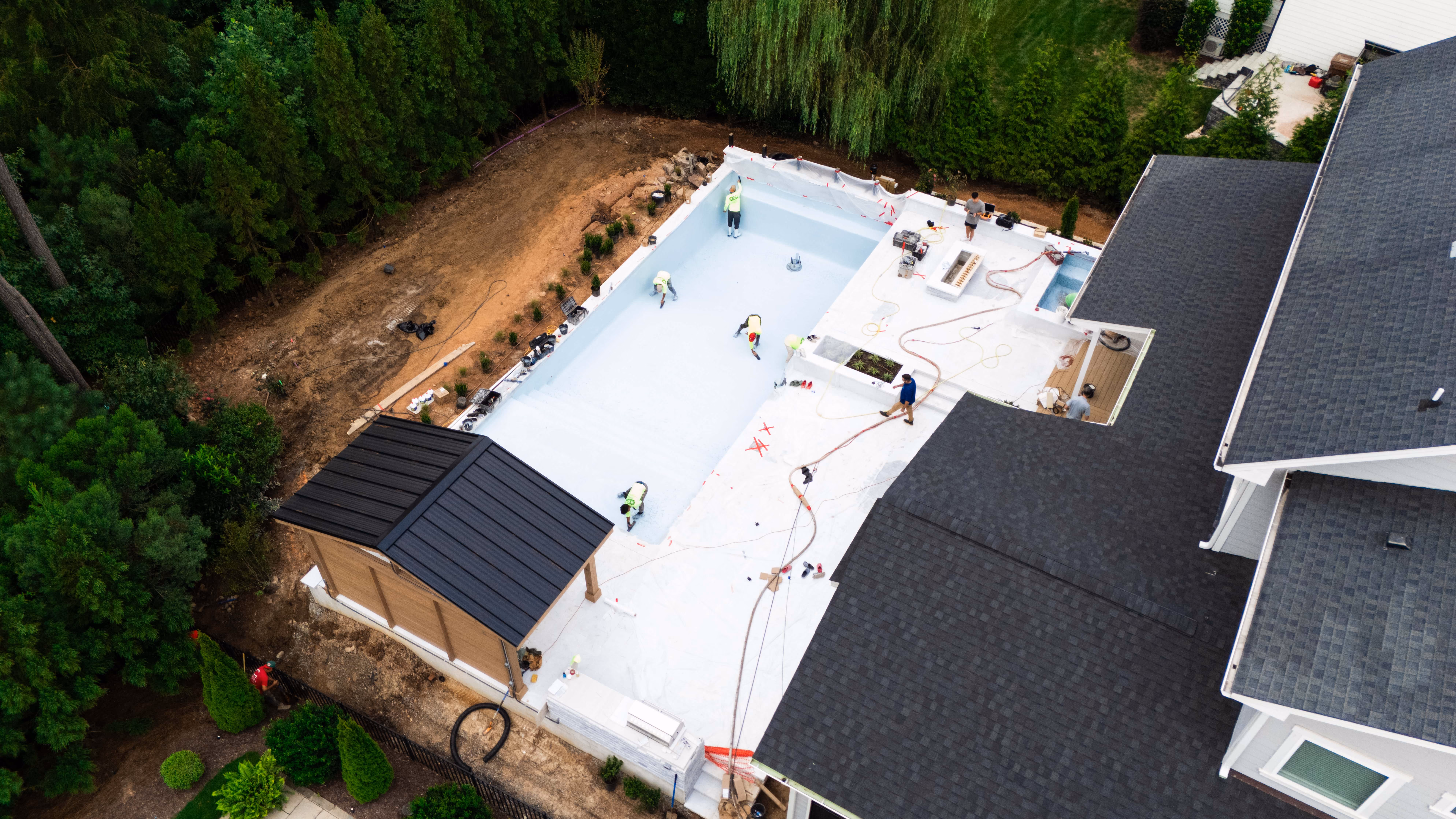 A behind-the-scenes view of professional luxury pool construction and site preparation by the Currin Outdoor Living team in Raleigh, NC.