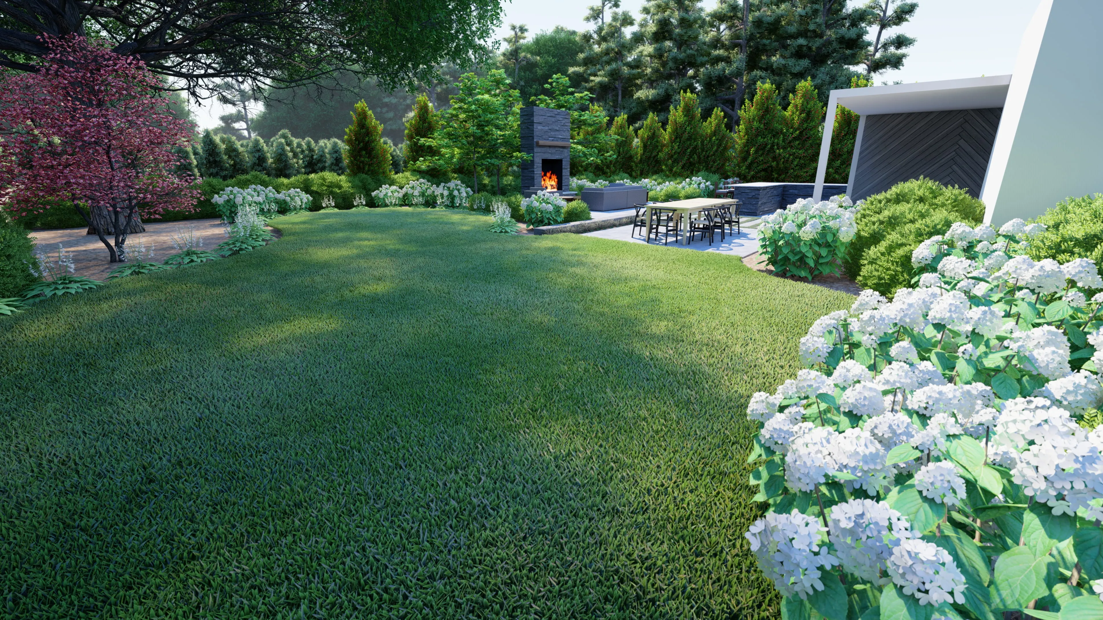 A stunning backyard oasis designed by Currin Outdoor Living, featuring a lush green lawn, mature landscape plantings, and a modern patio lounge area in a private Raleigh, NC residential setting.
