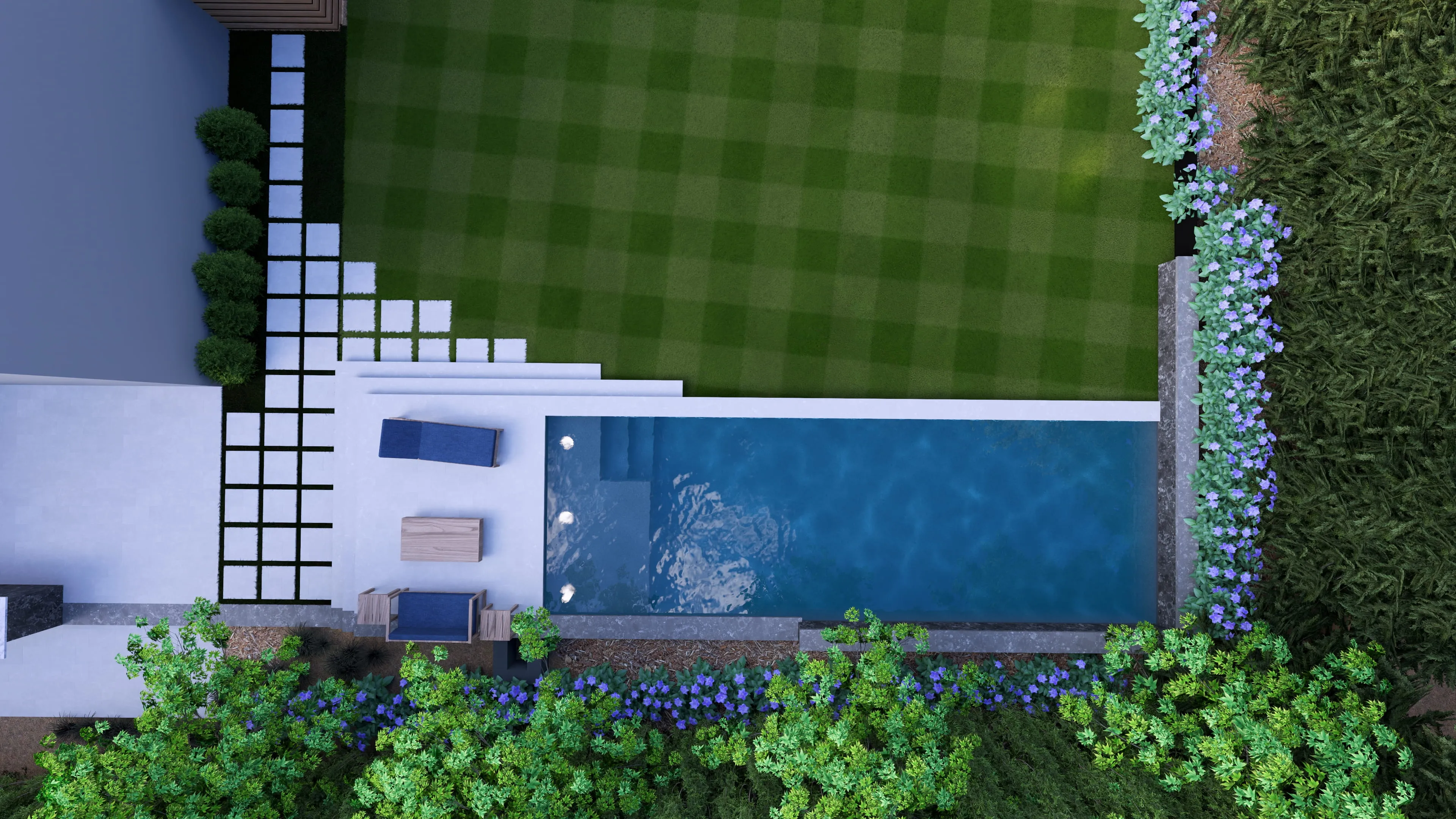Top-down aerial view of a luxury custom rectangular inground swimming pool featuring a tanning ledge, modern in-pool lounge chairs, a sprawling stone paver patio, and professional backyard landscape design built by an outdoor living company in Raleigh, NC.