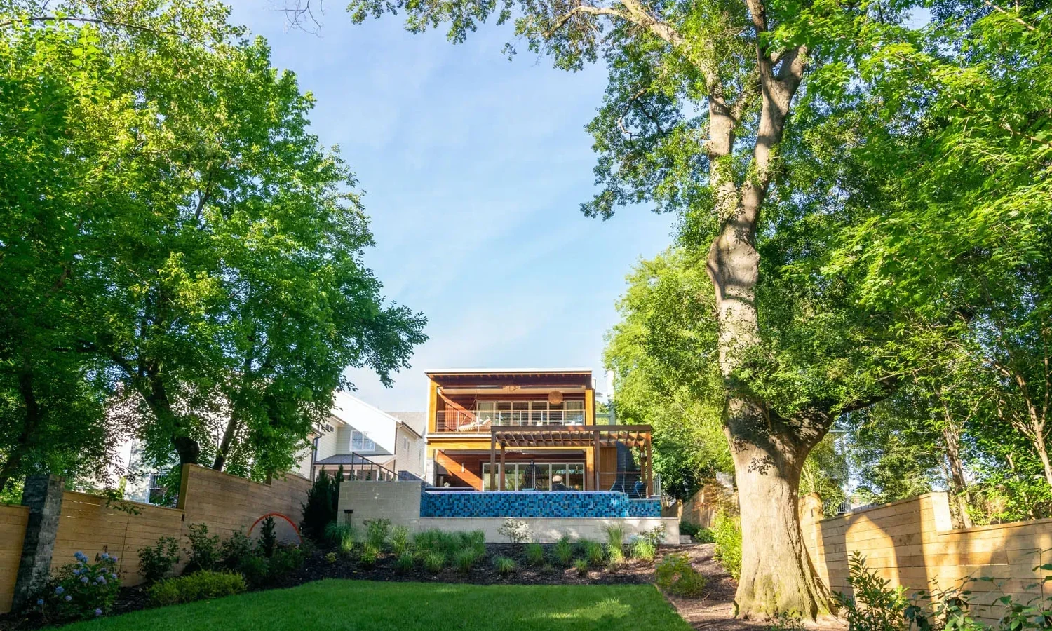 Landscape architecture usually covers large or public projects like parks, campuses, and commercial sites, and it often involves heavy engineering and site planning. For most Raleigh homeowners, residential landscape design is the better fit. It focuses on how your yard looks, feels, and works for your family, and a design-build team can carry the plan all the way to a finished yard. When you start searching for help with your yard, you'll see two terms pop up a lot: landscape architecture and landscape design. They sound alike, and they do overlap, but they're not the same thing. Knowing the difference can save you time and help you hire the right team for your Raleigh home. Let's break it down in simple terms. Landscape architecture vs. landscape design at a glance Landscape architecture Residential landscape design Typical projects Parks, campuses, streetscapes, commercial sites, large developments Front yards, backyards, pool areas, patios, gardens Main focus Site planning, grading, stormwater, public use Beauty, comfort, plants, and how your family uses the yard Who it's for Cities, developers, businesses, and some large estates Homeowners What you get Technical site plans and engineering-heavy drawings A clear yard plan, often with 3D visuals, ready to build Who builds it Usually a separate contractor Often the same design-build team What does a landscape architect do? A landscape architect plans outdoor spaces on a bigger scale. Their work often deals with: Large grading and earth-moving plans Stormwater systems for big sites Public spaces that many people will use Meeting city and development rules for commercial projects This kind of work is very important, but it's often more than a typical home project needs. What does a residential landscape designer do? A residential landscape designer focuses on your home and your lifestyle. They plan: Plants that suit your yard's sun, shade, and soil Walkways, custom patios, and retaining walls Outdoor living features like outdoor kitchens and fire pits Lighting, drainage, and privacy How a pool fits into the rest of the yard At Currin Outdoor Living, our landscape design team brings together design, horticulture, and construction know-how. Our leadership includes people with backgrounds in architecture, landscape horticulture, and landscape architecture firm experience, so your home project gets thoughtful planning from start to finish. You can meet the team on our about us page. Which one is right for your Raleigh project? Ask yourself these simple questions: You probably need residential landscape design if: You want to improve your front yard or backyard You're planning a patio, pool, outdoor kitchen, or garden You want one team to design and build the space Your main goal is a yard you enjoy every day You may need a landscape architect if: You're developing a commercial property or subdivision Your project needs major engineering or public approvals You're working on a large public or shared space For most homeowners in Raleigh, Cary, Apex, and nearby towns, the first list sounds much more familiar. Why design-build makes life easier for homeowners With a traditional approach, one firm draws the plan and another company builds it. That can lead to missed details and back-and-forth between teams. With design-build, the same team handles it all: Design: We plan your yard and help you see it before it's built. Build: Our crew handles the landscape build with regular updates along the way. Maintain: Our landscape maintenance team helps keep your yard healthy long after the project ends. You can see every step in detail on our process page. See the results for yourself The best way to judge any design team is by looking at their finished work. Explore our portfolio to see pools, patios, outdoor kitchens, and full backyard makeovers across the Triangle. Start your Raleigh yard project the right way If you're a homeowner looking for landscape architecture in Raleigh, NC, there's a good chance that what you really want is a well-planned yard built by a team you can trust. That's what we do every day. Request a consultation with Currin Outdoor Living and let's talk about your space. Frequently asked questions Is landscape design the same as landscape architecture? Not exactly. Both plan outdoor spaces, but landscape architecture often deals with large public and commercial sites, while landscape design focuses on homes and how families use their yards. For most home projects, residential landscape design is the right fit. Do I need a landscape architect for my backyard? Most homeowners don't. A backyard with patios, plants, lighting, or a pool is usually best handled by a residential design team that also builds the project. Our backyard design service is made for exactly this kind of work. Can a landscape designer handle grading and drainage? Yes, for most home projects. Good residential design plans for slopes, retaining walls, and where rainwater goes. These details are built into the plan before work begins, as part of our landscape services. Will I be able to see my design before it's built? Yes. You'll review the finished design before anything is built, and 3D models are available for more complex projects so you can picture the space clearly. Learn more on our process page. Can you design a pool and landscape together? Yes. Planning both at once is the best way to get a yard that flows. Our pool and landscape designers work as one team, so everything fits. Check out our pool design approach to learn more. Do you handle permits for home landscape projects? Yes. Construction drawings, permits, and build preparation are part of our design process, so you don't have to figure it out alone. Contact us to talk about what your project may need. Do you serve areas outside Raleigh? Yes. We work with homeowners across Wake County and the Triangle, including Cary, Apex, Wake Forest, Chapel Hill, and Durham. See the full list on our service areas page.