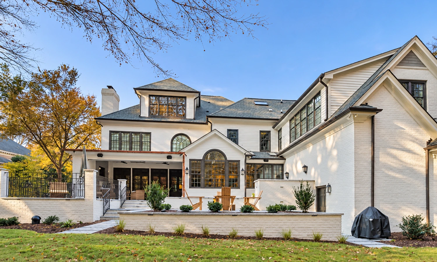 Luxury residential home with custom front yard landscape design and manicured lawn in Raleigh NC