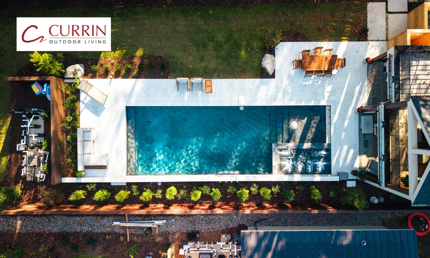 Aerial view of custom vertical pool design and patio hardscaping in Raleigh NC
