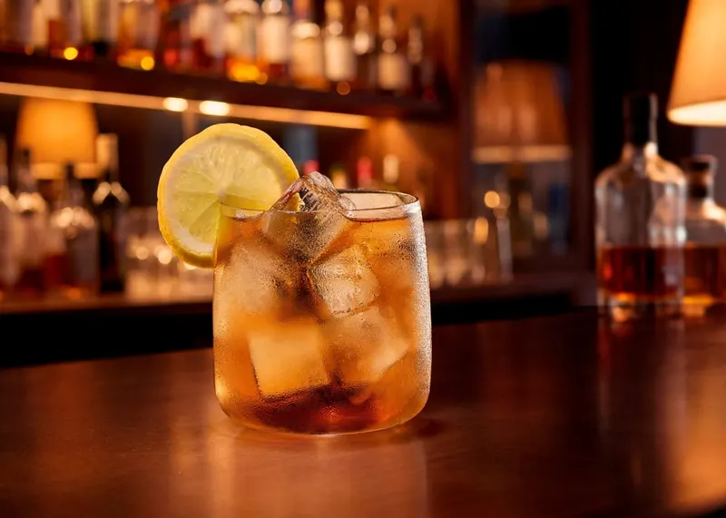 A cocktail over Local Ice cubes on a bar counter