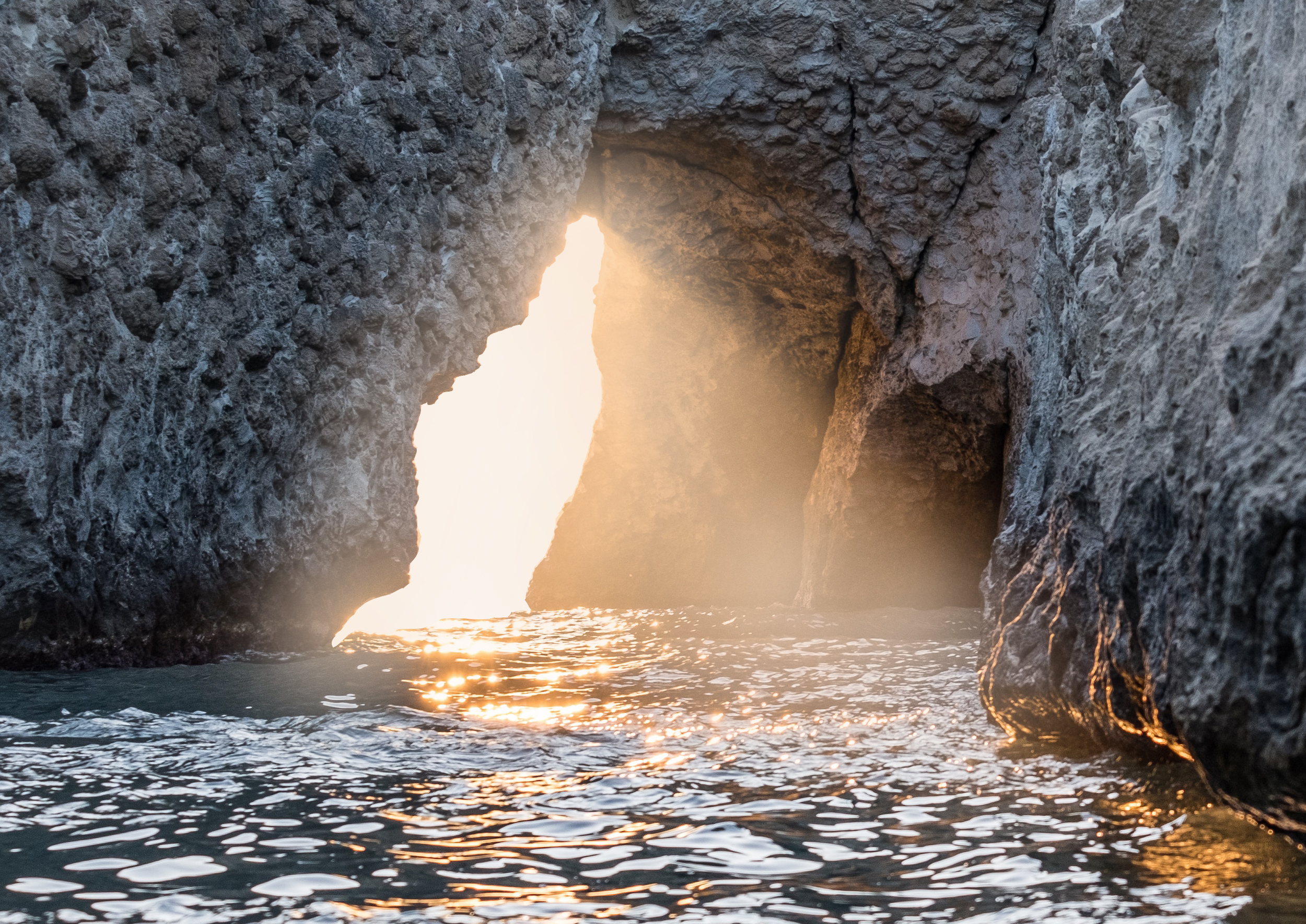 The light glows and intensifies, inviting us to pass through the portal.