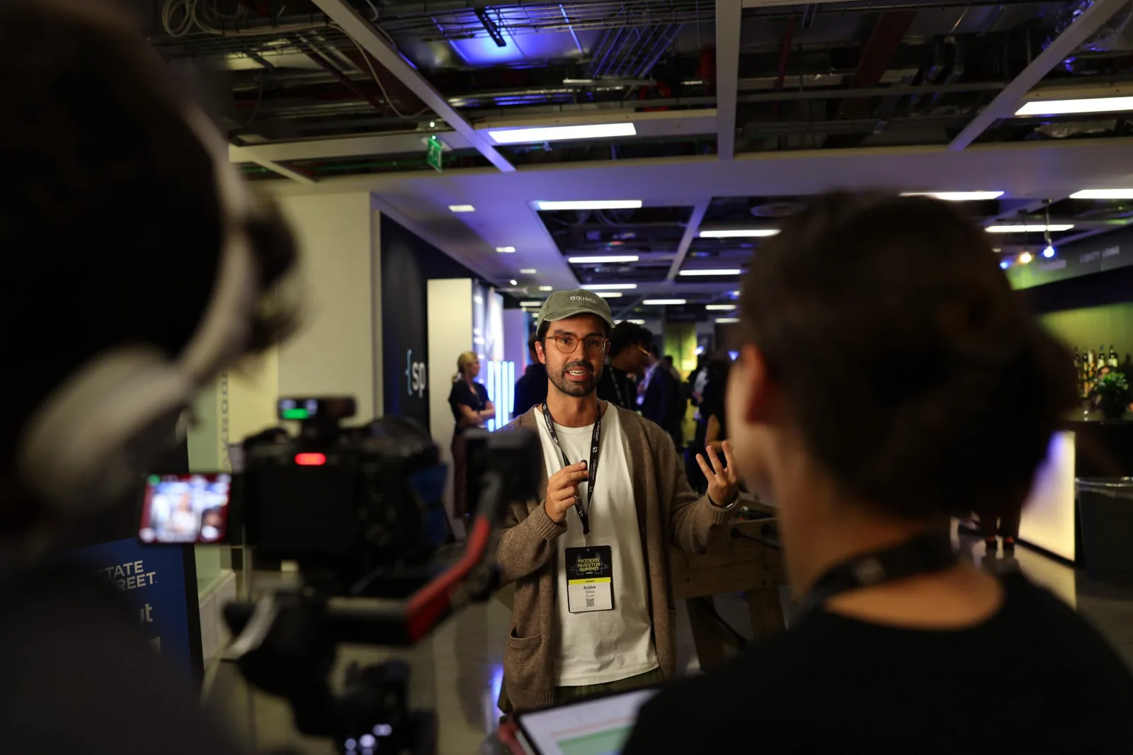 A partner speaker being interviewed on camera at the Modern Investor Summit London