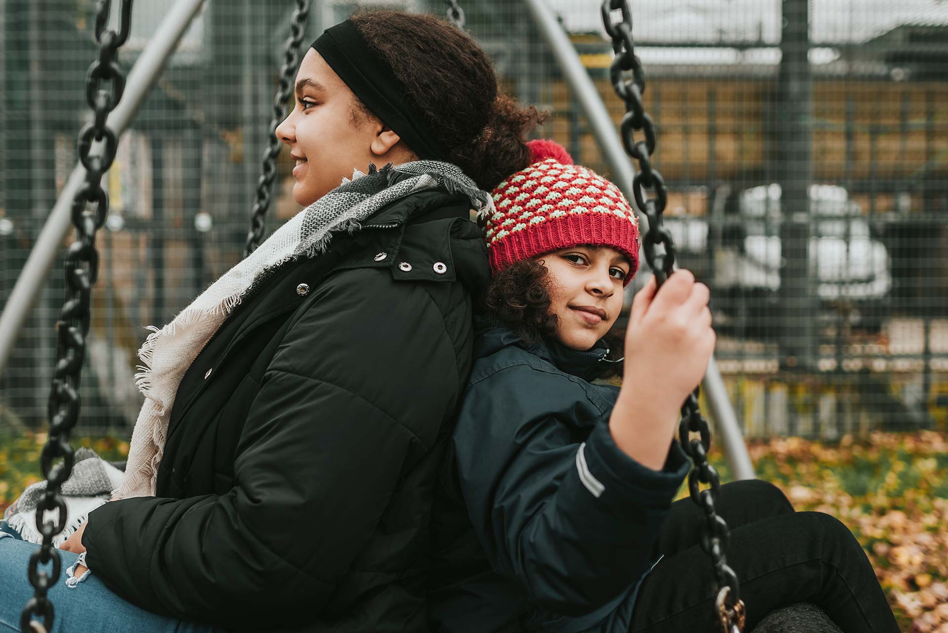 Two girls on a swing