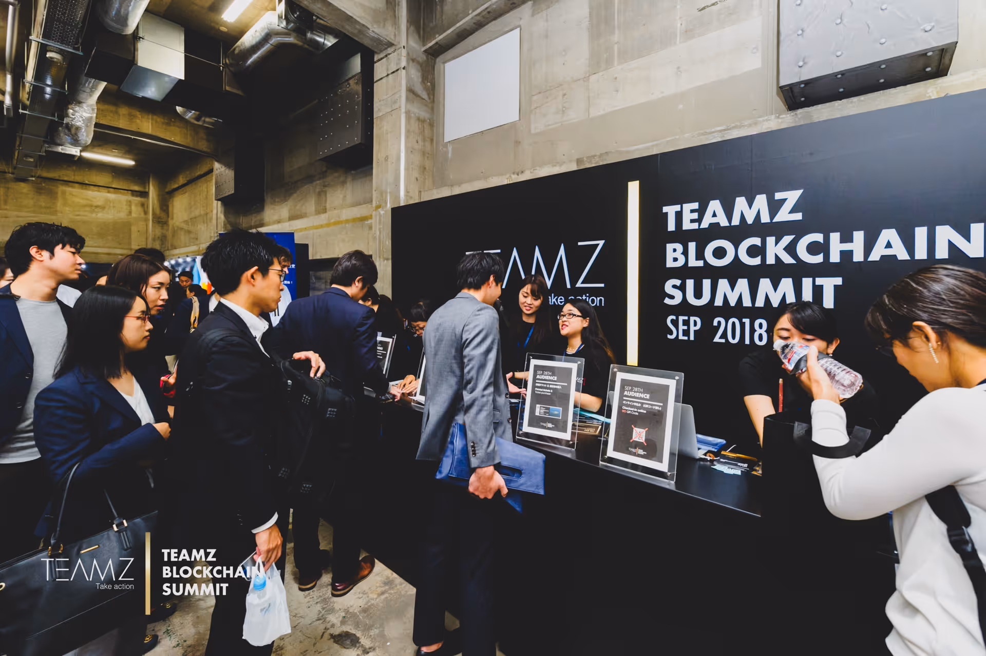 People at the front desk for the TEAMZ 2019 Summit in Tokyo.