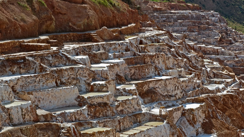 Drone carrying a magnetometer sensor surveying an archaeological site