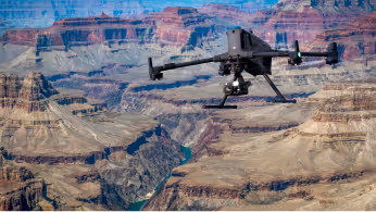 Drone flying over a mining site during a geophysical survey for mineral exploration